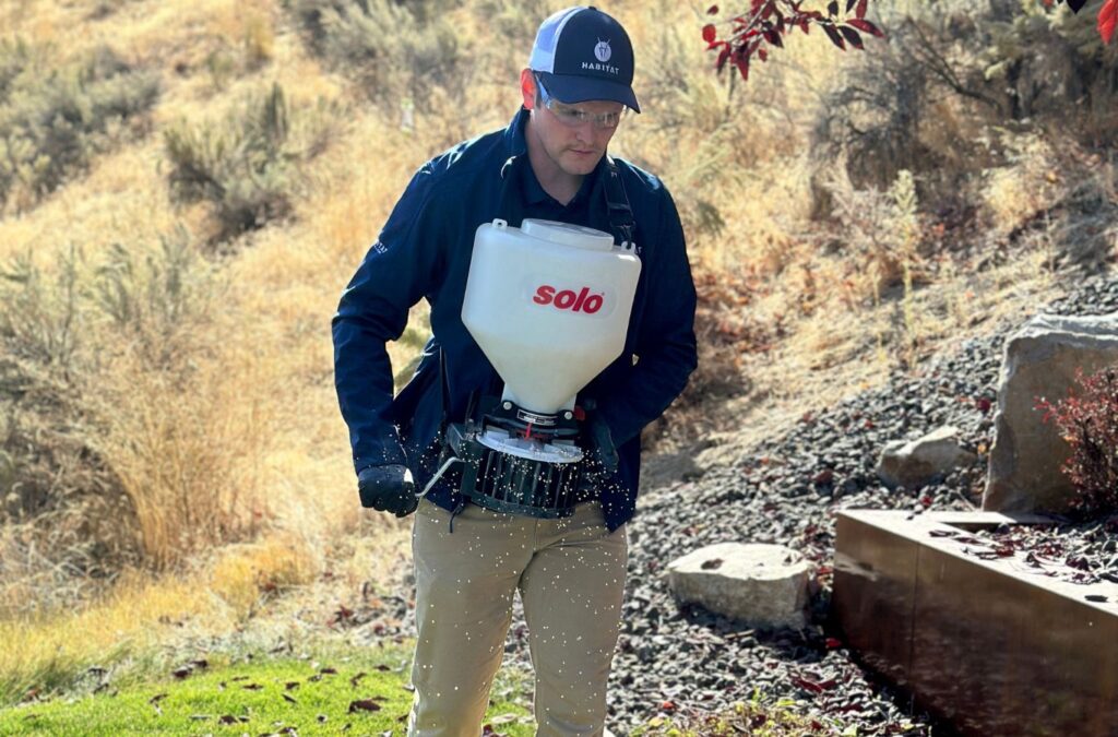 A professional from Habitat Pest & Lawn demonstrating eco-friendly pest control techniques in Ada County, Idaho.